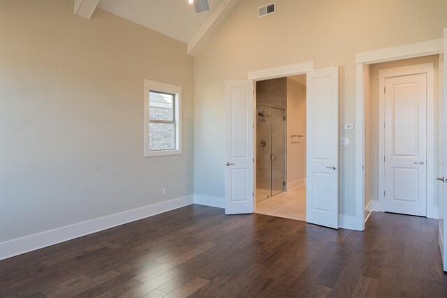 unfurnished bedroom featuring dark hardwood / wood-style flooring and high vaulted ceiling