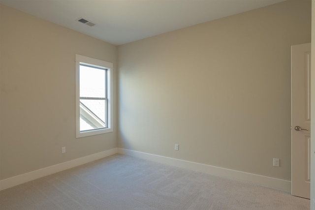 empty room with light colored carpet