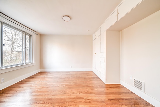 unfurnished room featuring light hardwood / wood-style flooring