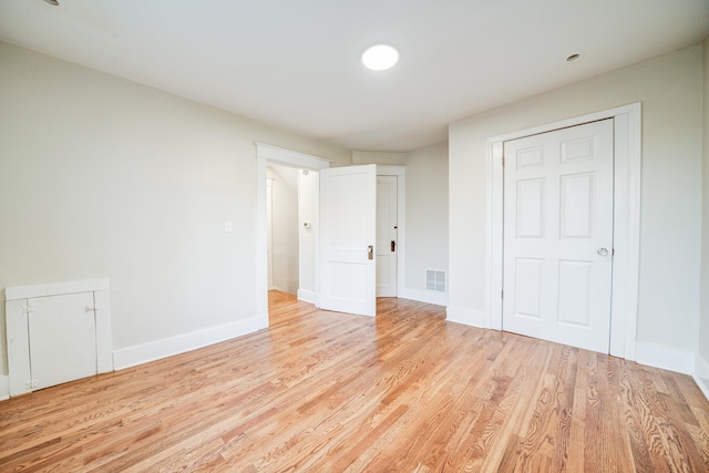 unfurnished bedroom with light wood-type flooring