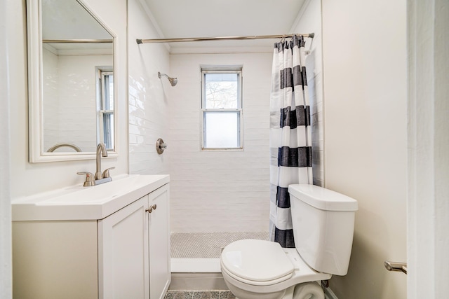 bathroom with vanity, a shower with shower curtain, and toilet