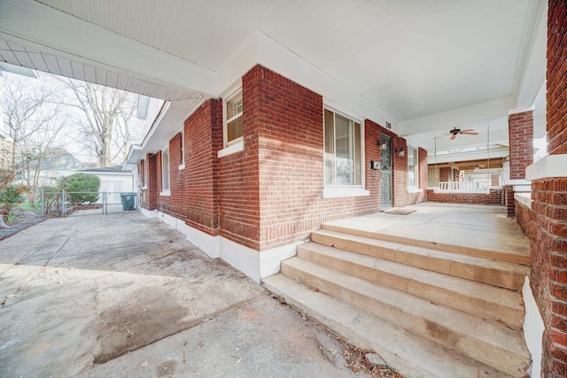 exterior space featuring ceiling fan and a porch