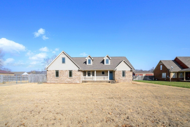 view of front of home featuring a front lawn and a porch