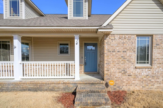 doorway to property featuring a porch