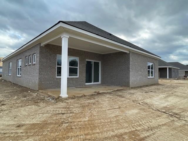 rear view of house featuring a patio