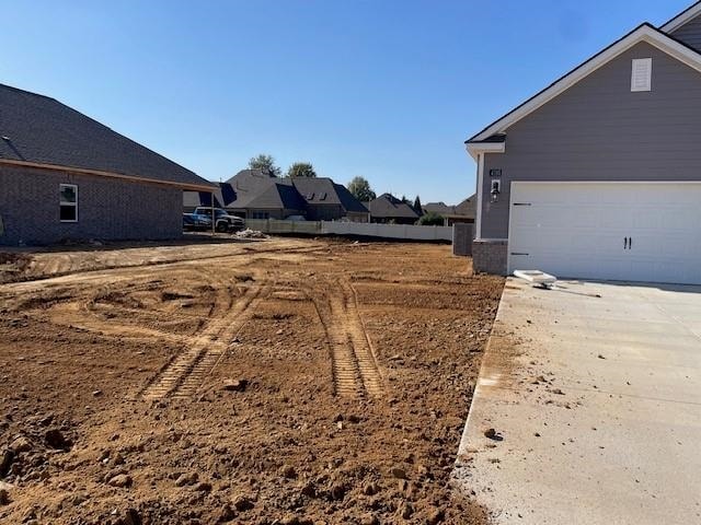 view of yard with a garage