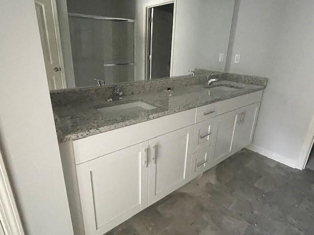 bathroom featuring vanity and concrete flooring