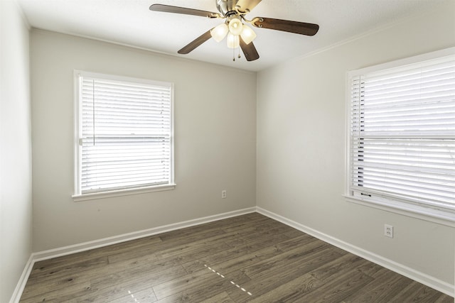 unfurnished room with dark hardwood / wood-style floors and ceiling fan