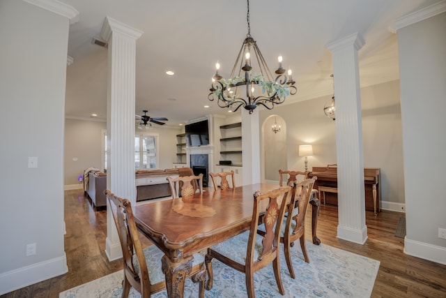 dining area with ceiling fan, ornamental molding, dark hardwood / wood-style floors, and ornate columns