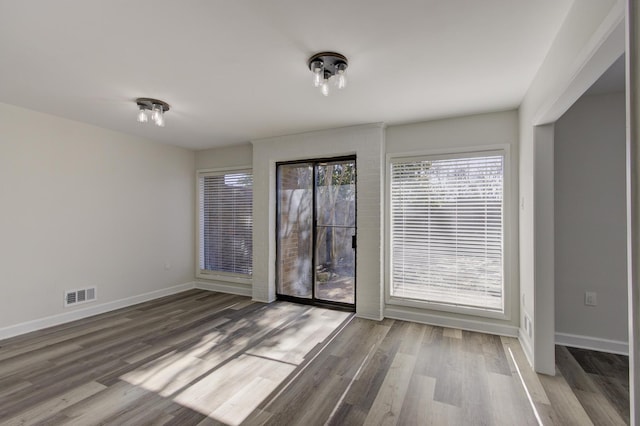 unfurnished room featuring wood-type flooring