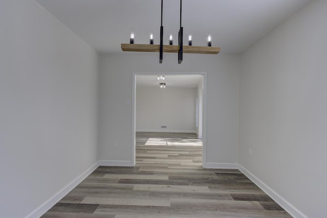 unfurnished dining area featuring hardwood / wood-style flooring