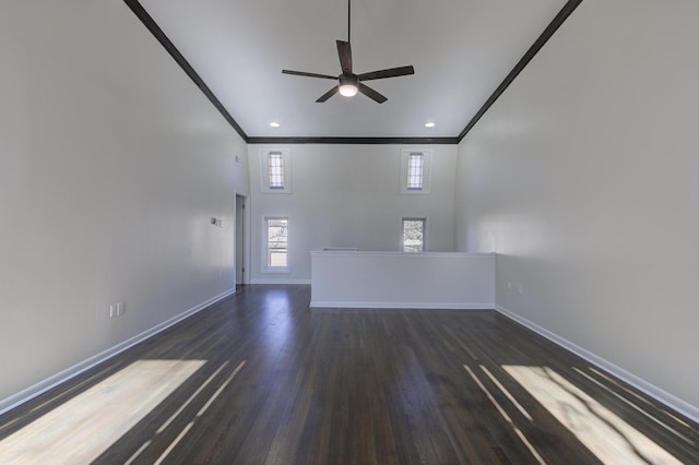 spare room featuring crown molding, ceiling fan, and dark hardwood / wood-style flooring