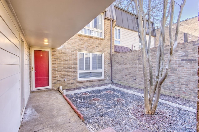 entrance to property featuring a patio area