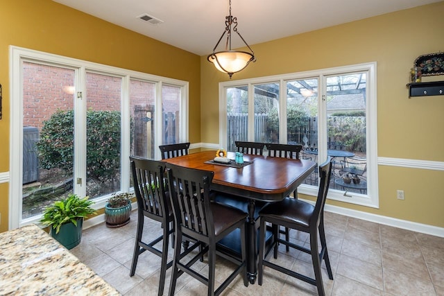 dining space featuring tile patterned floors