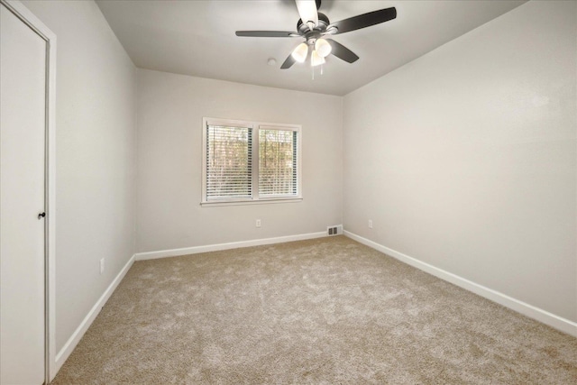 carpeted empty room with ceiling fan