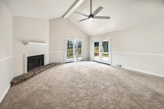 unfurnished living room with ceiling fan, high vaulted ceiling, carpet floors, french doors, and beamed ceiling