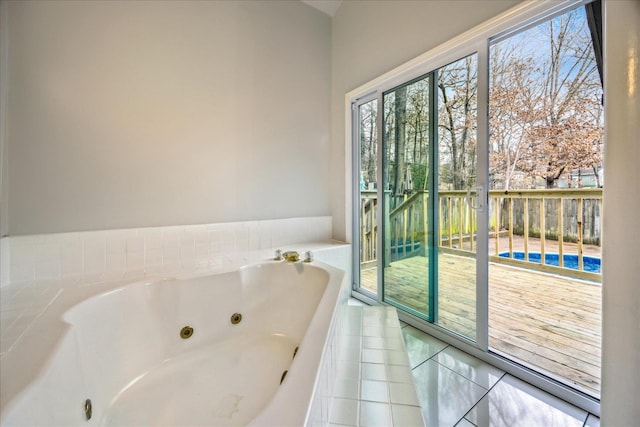 bathroom featuring tile patterned flooring and a bathtub