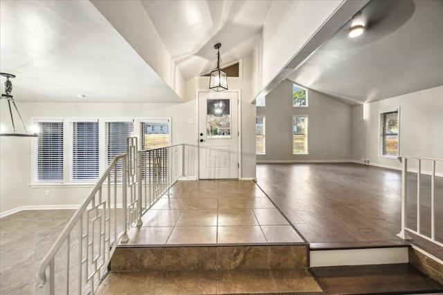 entrance foyer featuring lofted ceiling