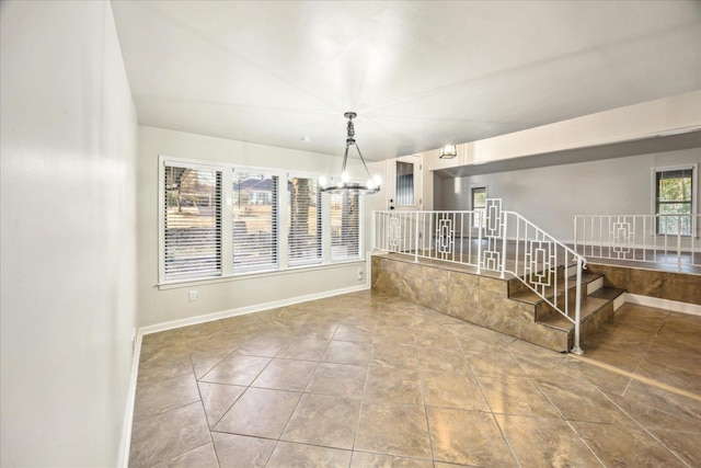 interior space featuring tile patterned flooring and a chandelier