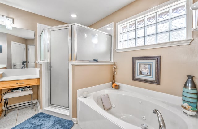 bathroom featuring tile patterned flooring, vanity, and separate shower and tub