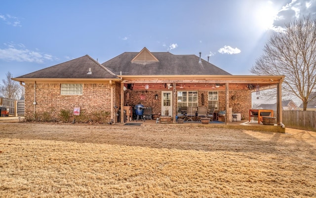 rear view of property featuring a patio area