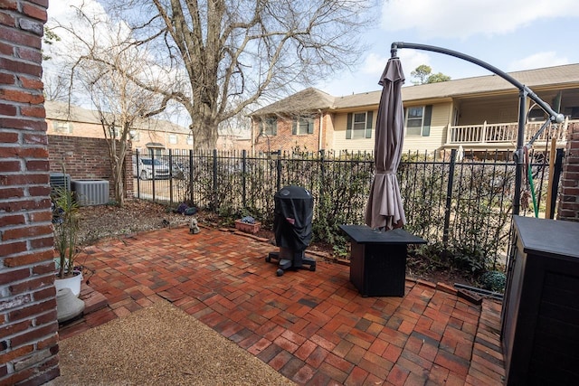 view of patio featuring a grill and central AC unit