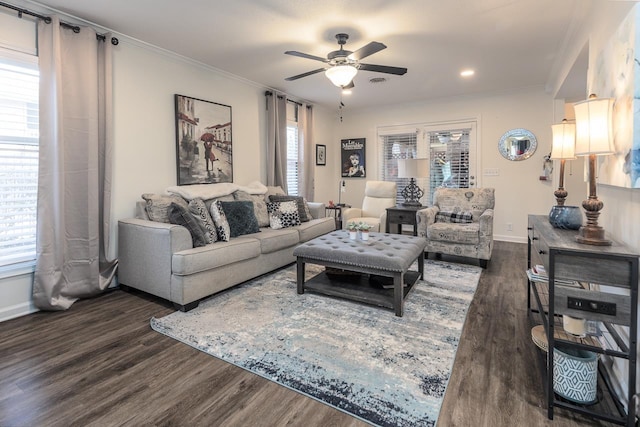 living room featuring crown molding, dark hardwood / wood-style floors, and ceiling fan