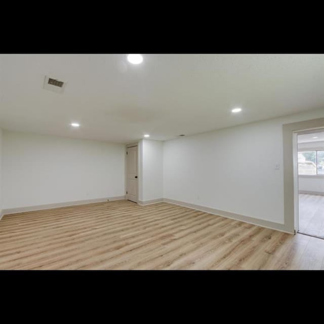 basement featuring light hardwood / wood-style flooring