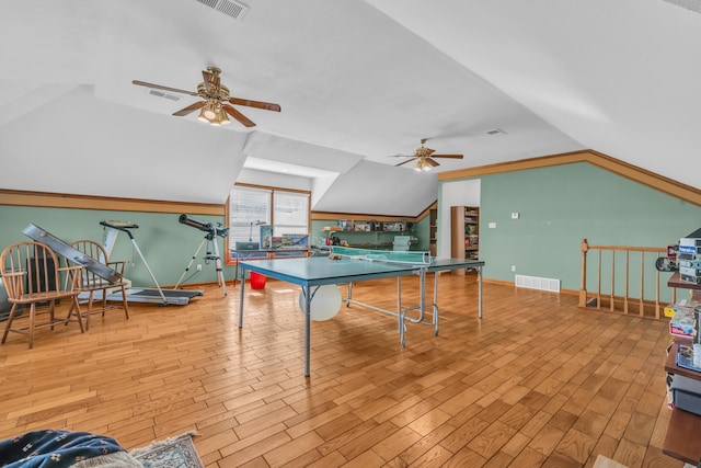 rec room featuring vaulted ceiling, ceiling fan, and light wood-type flooring