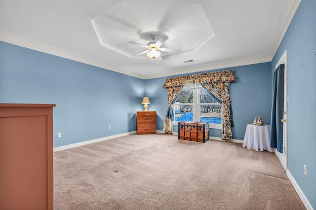 unfurnished bedroom with ornamental molding, carpet flooring, and ceiling fan