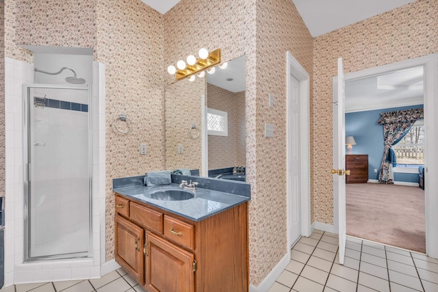 bathroom featuring tile patterned flooring, vanity, and a shower with shower door