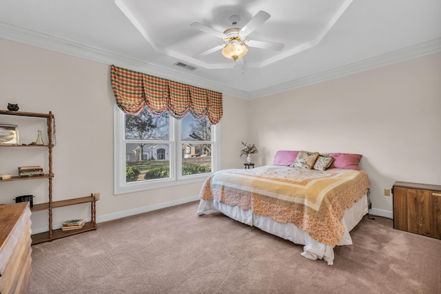 carpeted bedroom with crown molding, a raised ceiling, and ceiling fan