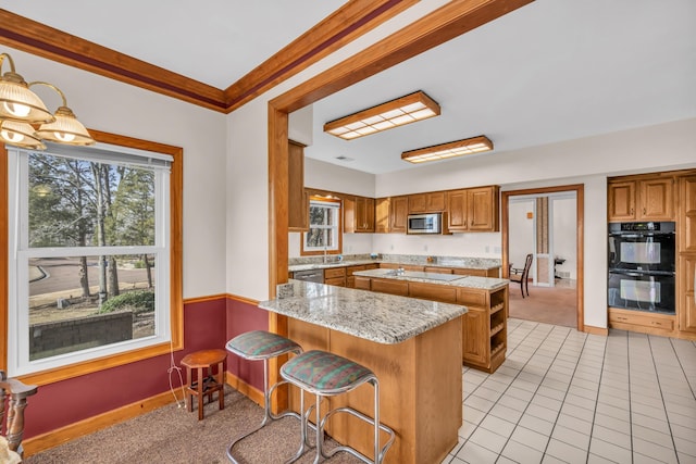 kitchen with light tile patterned flooring, a breakfast bar, kitchen peninsula, ornamental molding, and black appliances