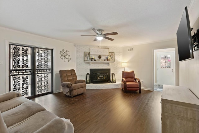 living room with dark hardwood / wood-style flooring, crown molding, a textured ceiling, and ceiling fan