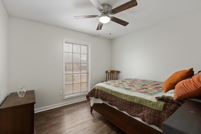 bedroom with ceiling fan and dark hardwood / wood-style flooring