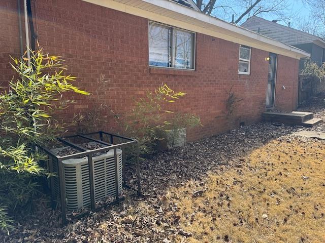 view of home's exterior featuring central AC unit