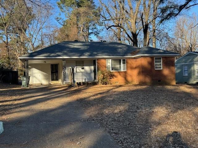 view of front of home with a carport