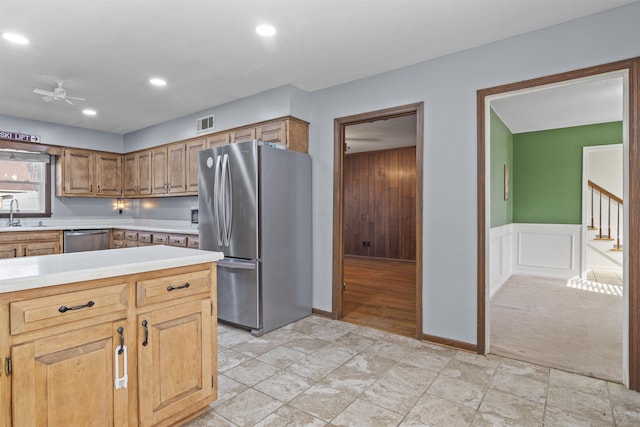 kitchen with sink, stainless steel appliances, and ceiling fan