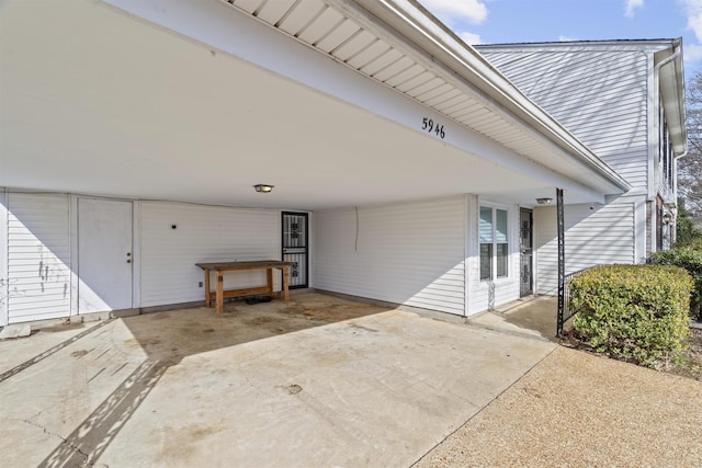 exterior space with a carport