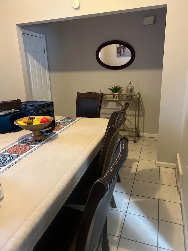 dining area featuring light tile patterned floors