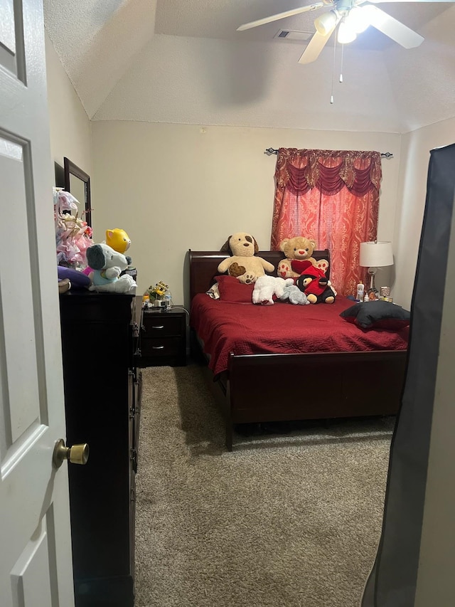 bedroom featuring carpet, vaulted ceiling, and ceiling fan