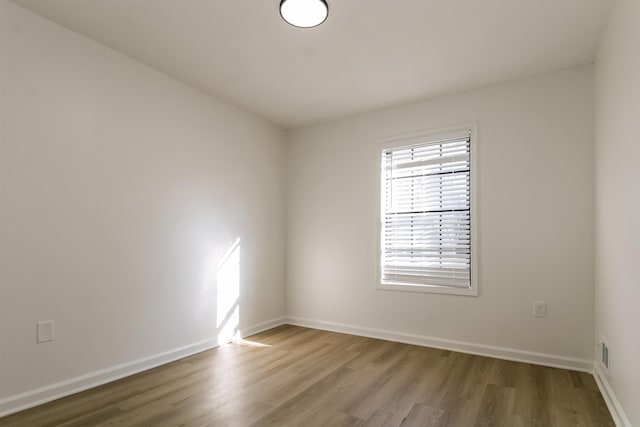 empty room featuring hardwood / wood-style floors