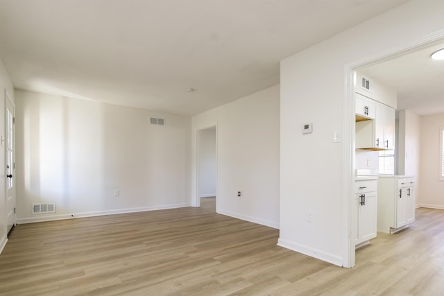 spare room featuring light hardwood / wood-style flooring