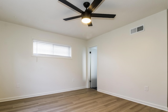 unfurnished room with ceiling fan and light hardwood / wood-style floors