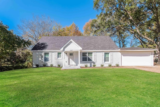 view of front of home with a garage and a front yard