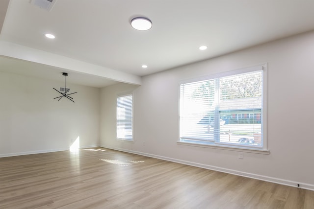 spare room featuring light hardwood / wood-style flooring