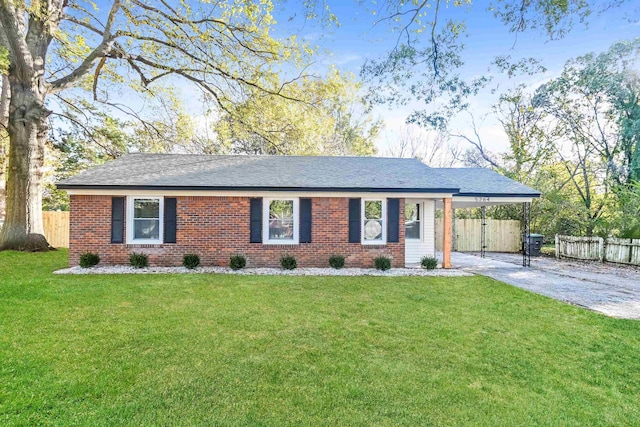 single story home featuring a front yard and a carport