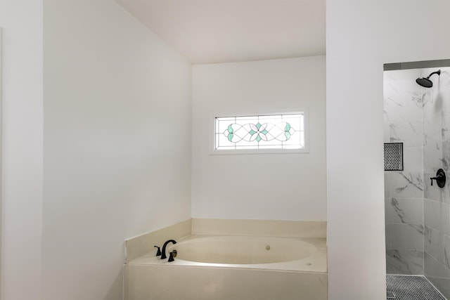 bathroom featuring separate shower and tub