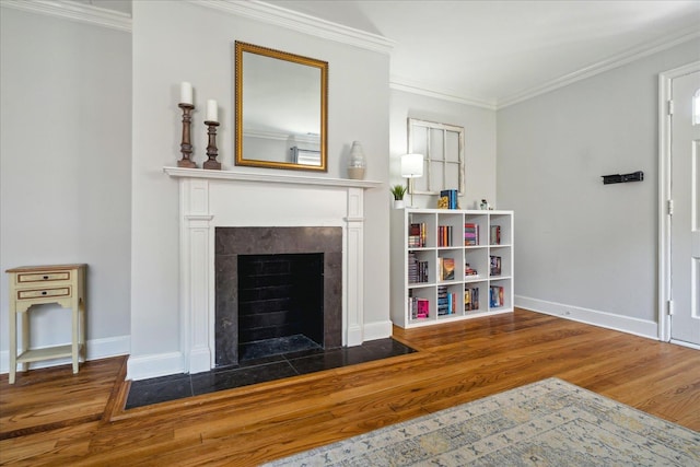 living room featuring wood-type flooring and ornamental molding