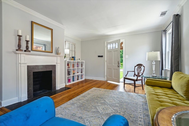 living room featuring ornamental molding and hardwood / wood-style floors